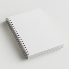 White spiral notebook mockup on white surface