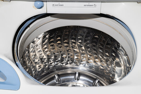 Inside of empty clothes washing machine with stainless steel