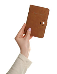 Obraz premium Woman holding passport in brown cover on white background, closeup