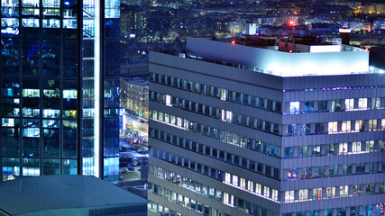 Aerial photography of modern architectural landscapes at night. Lights in the windows of buildings....