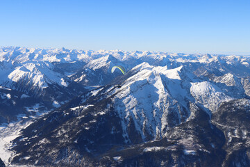 Fototapeta premium Flying over snow covered peaks