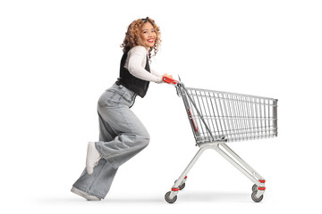 Asian woman running and pushing a shopping cart © Ljupco Smokovski