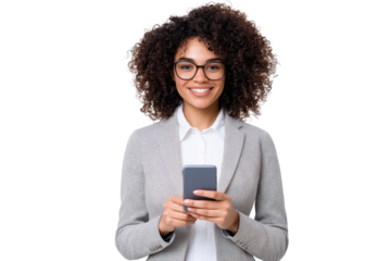 A confident woman with curly hair and glasses smiles while holding smartphone, dressed in professional gray blazer, isolated on transparency background