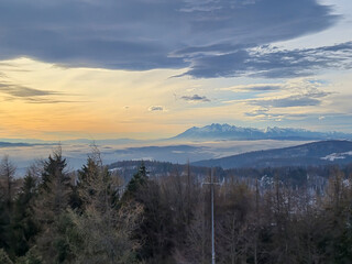 Scenic view of mountains at sunset with dramatic clouds and serene landscape