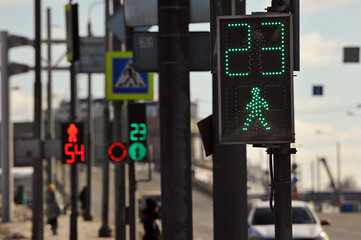 the traffic light of the pedestrian crossing is green