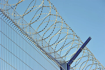 barbed wire on the fence of a protected facility