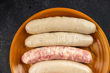 raw sausages pork, beef, chicken, lamb fresh tasty food dish delicious gourmet food background on the table rustic food top view copy space