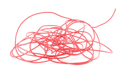 Tangled insulated electrical wire isolated on white