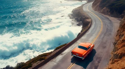 Fototapete Rund Vintage Car on Coastal Highway with Crashing Ocean Waves and Scenic Views © Nipawan