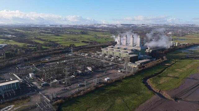 Aerial view of large power station and substation in the United Kingdom. Electricity grid concept