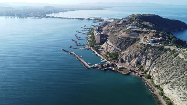 Aerial panoramic view of El Morro de Barcelona, historic fort on the coast of Lecheria, Venezuela, at sunset, beach, sea, and mountains &ndash; Travel and natural landscape