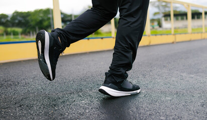 Man jogging with large copy space in the foreground