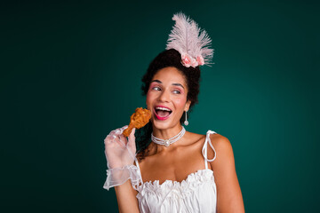 Photo of aristocratic lady in luxury ancient outfit enjoy era difference eat bite fried chicken...