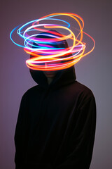 Abstract portrait of a hooded figure with multicolored neon light trails swirling around the head, conceptual art style. Futuristic concept of info technology and Ai systems