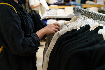 Shopping for stylish clothes in a modern retail store during the day