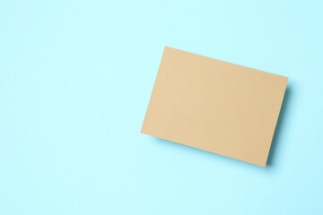 Craft paper card on color background