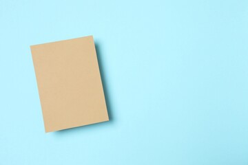 Craft paper card on color background