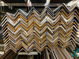 A meticulously arranged stack of durable metal angles forms a strong and reliable structure that is...