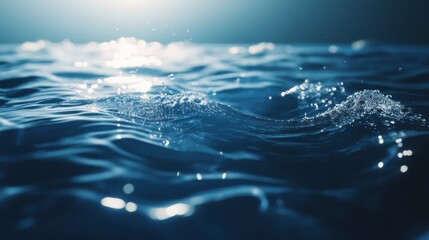 Serene close-up of rippling water, capturing reflections and bubbles in a tranquil blue setting.