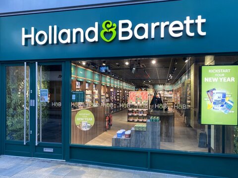 Bracknell, England - January 09, 2025: The entrance and window display of the Holland & Barrett store in Bracknell, England. H & B are health and wellness retailers. 