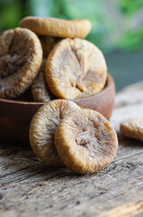 Sun dried figs on rustic table, organic tasty fruits, healthy dry fruit concept