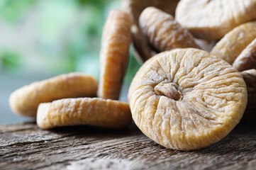 Sun dried figs on rustic table, organic tasty fruits, healthy dry fruit concept