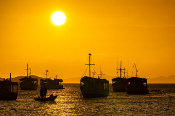 Fototapeta premium Landscape themes: Fishing boats in Juan Griego Bay at sunset. Margarita Island, Venezuela.