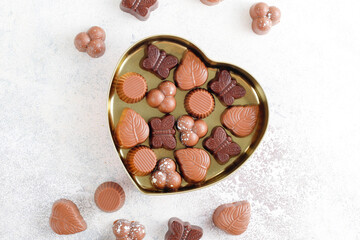 Handmade chocolate with pistachios, dark and milk chocolate pieces.