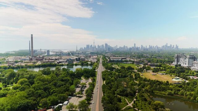 Stunning Aerial View of a Vibrant City Skyline Set Against a Beautiful Green Landscape and Flowing Waterway. Canada, Ontario, Toronto, Woodbine Beach