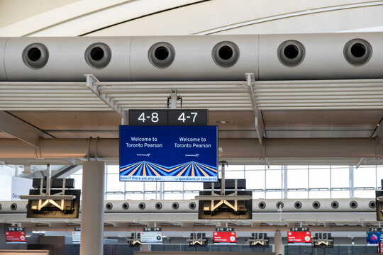 Sign on screen welcome to Toronto Pearson with the logo at the Toronto International Airport.