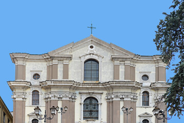 Front gable, of the baroque church of Santa Maria Maggiore with blue sky on a summer day in Trieste, Italy