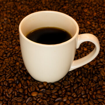 cup of coffee with beans