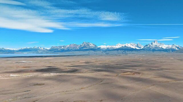 Andean Dreamscape. Discover the hidden paradise of the Argentinian Andes. Snow-capped mountains, a pristine lake, and a sandy beach await in this stunning drone footage. 12.01.2025