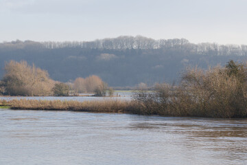 Flooded river landscape and distant hills