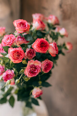 Tender pink Rose flowers in a vase on a natural pastel background.
