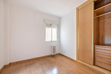 Obraz premium Built-in wardrobes can range from modern, minimalist styles, with smooth doors and neutral-colored finishes