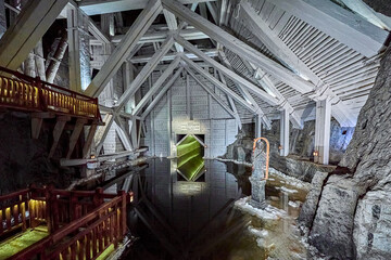 Wooden structures with man made water reserve below ground in the Wieliczka Salt Mine, the wood is painted white with lime to prevent corrosion, Wieliczka, Poland, Europe