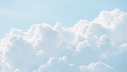 Delicate layers of soft cotton clouds in a serene sky