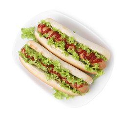 Tasty hot dogs with lettuce and ketchup isolated on white, top view