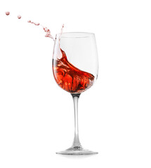Rose wine splashing in glass on white background