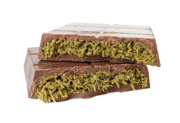 Pieces of tasty Dubai chocolate with pistachios and knafeh isolated on white