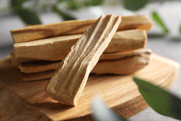 Pile of palo santo sticks on table, closeup