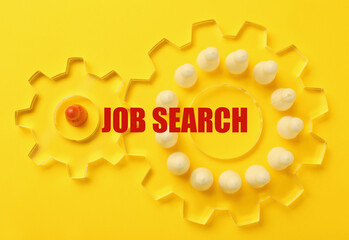 Job search. Game pieces in two transparent cogwheels on yellow background, top view