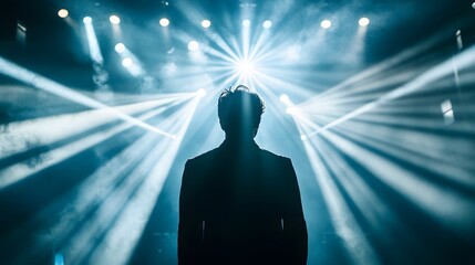 Silhouetted Person Bathed In Stage Lighting Rays