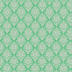 Green damask seamless pattern featuring ornate baroque floral motifs and dotted detailing. Suitable for wallpaper, textiles, vintage backgrounds, and decorative design use.