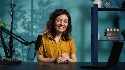 Content creator utilizes recording gear to shoot introductory segment for vlog channel, close up....