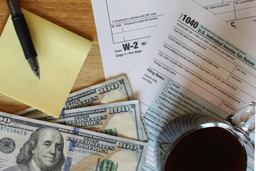 IRS 1040 and W-2 tax forms, close up, top down view 