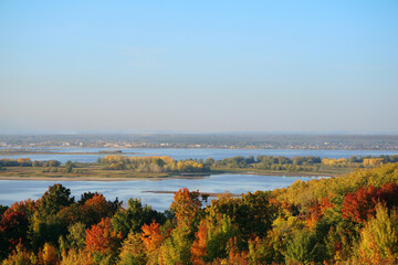 autumn landscape with river view and red yellow trees