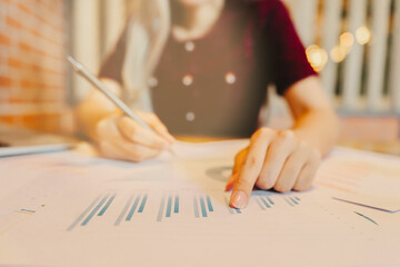 Detailed Analysis of Financial Reports and Progress Charts in Office Setting