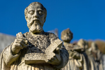 Obraz premium Stone statue representing several saints, with emphasis on Saint Stephen, belonging to the episcopal garden of the city of Castelo Branco-Portugal.